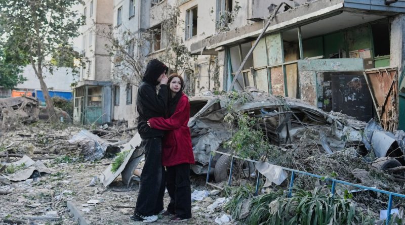 Russian attack on Ukraine capital kills at least 3 and traps others in damaged buildings